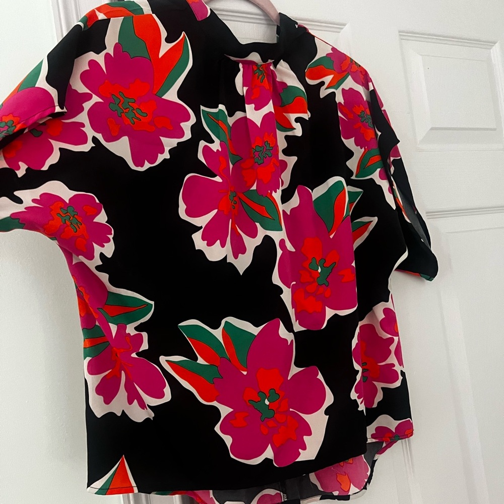 A floral blouse with a tie in the back for the neck